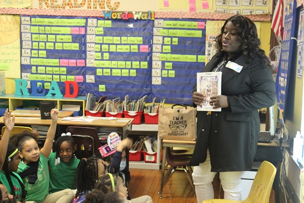 Ms. Cheron reads her own authored book to students in Ms. Gamble's class!